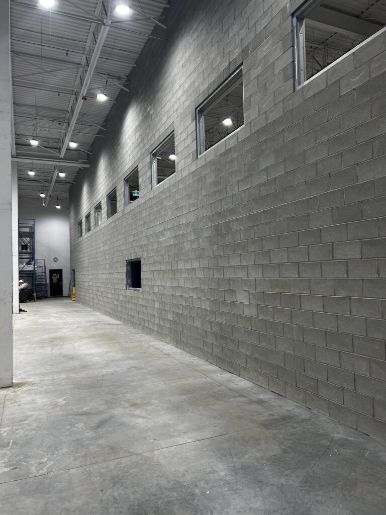 Concrete masonry unit block installation at an Edmonton commercial project
