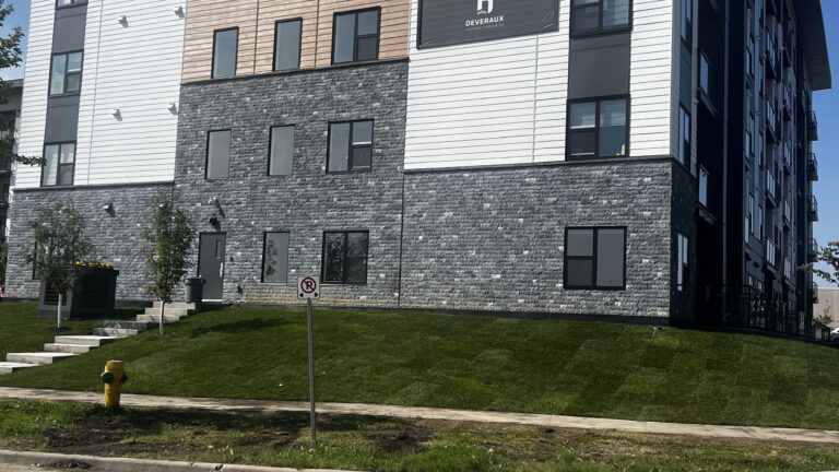 Black marble splitface stone supplied and installed by Met Exteriors for a multi-family project in Sherwood Park Alberta