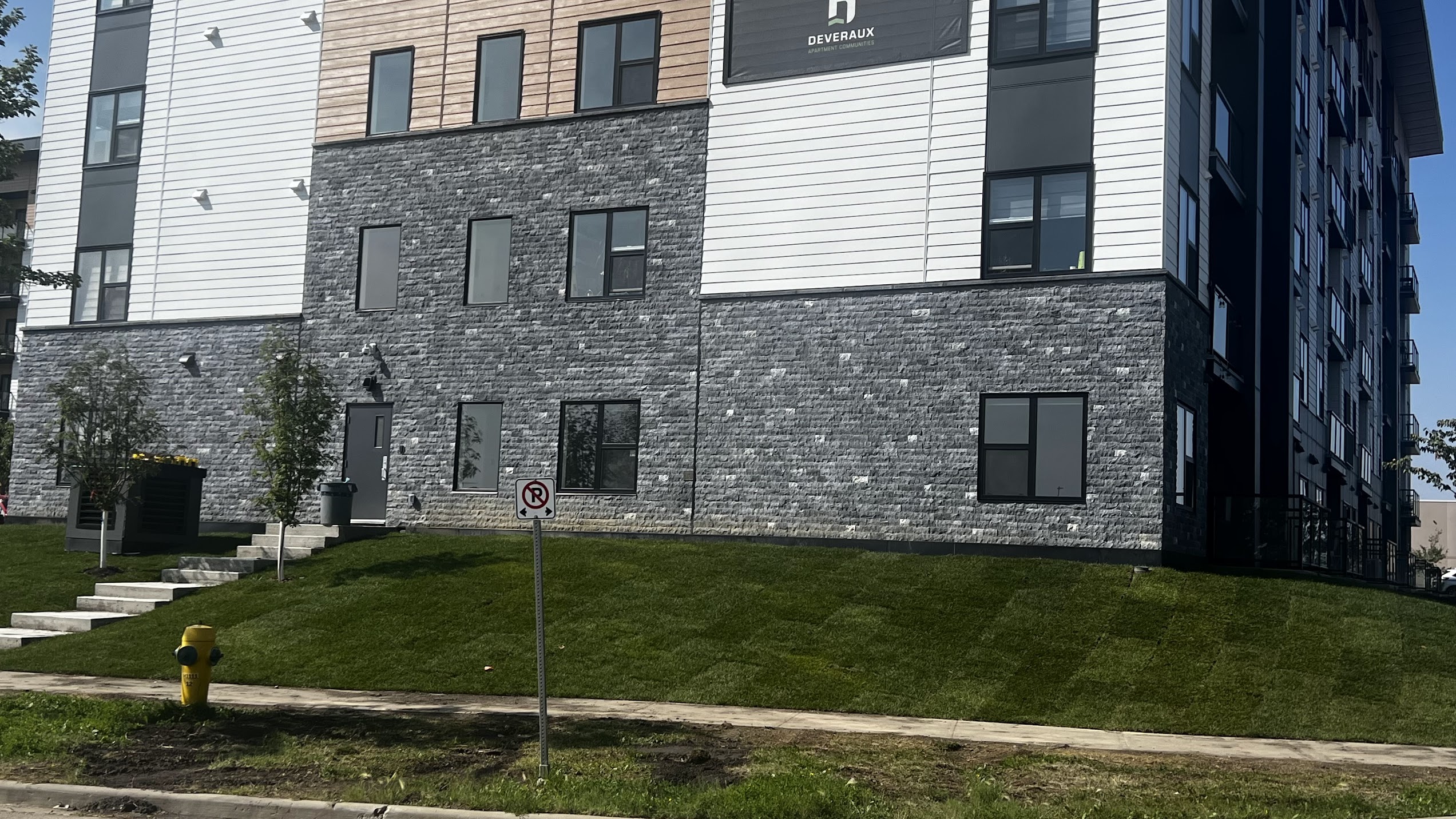 Black marble splitface stone supplied and installed by Met Exteriors for a multi-family project in Sherwood Park Alberta