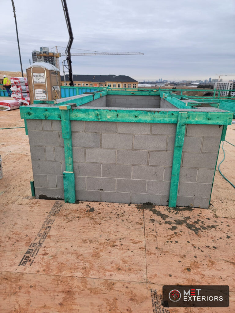 Reinforced CMU elevator shaft masonry by Met Exteriors in Edmonton Alberta