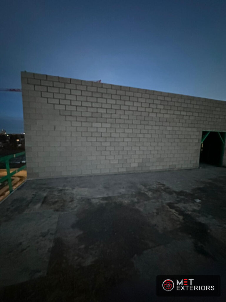 Concrete block firewall elevation built by Met Exteriors in Edmonton