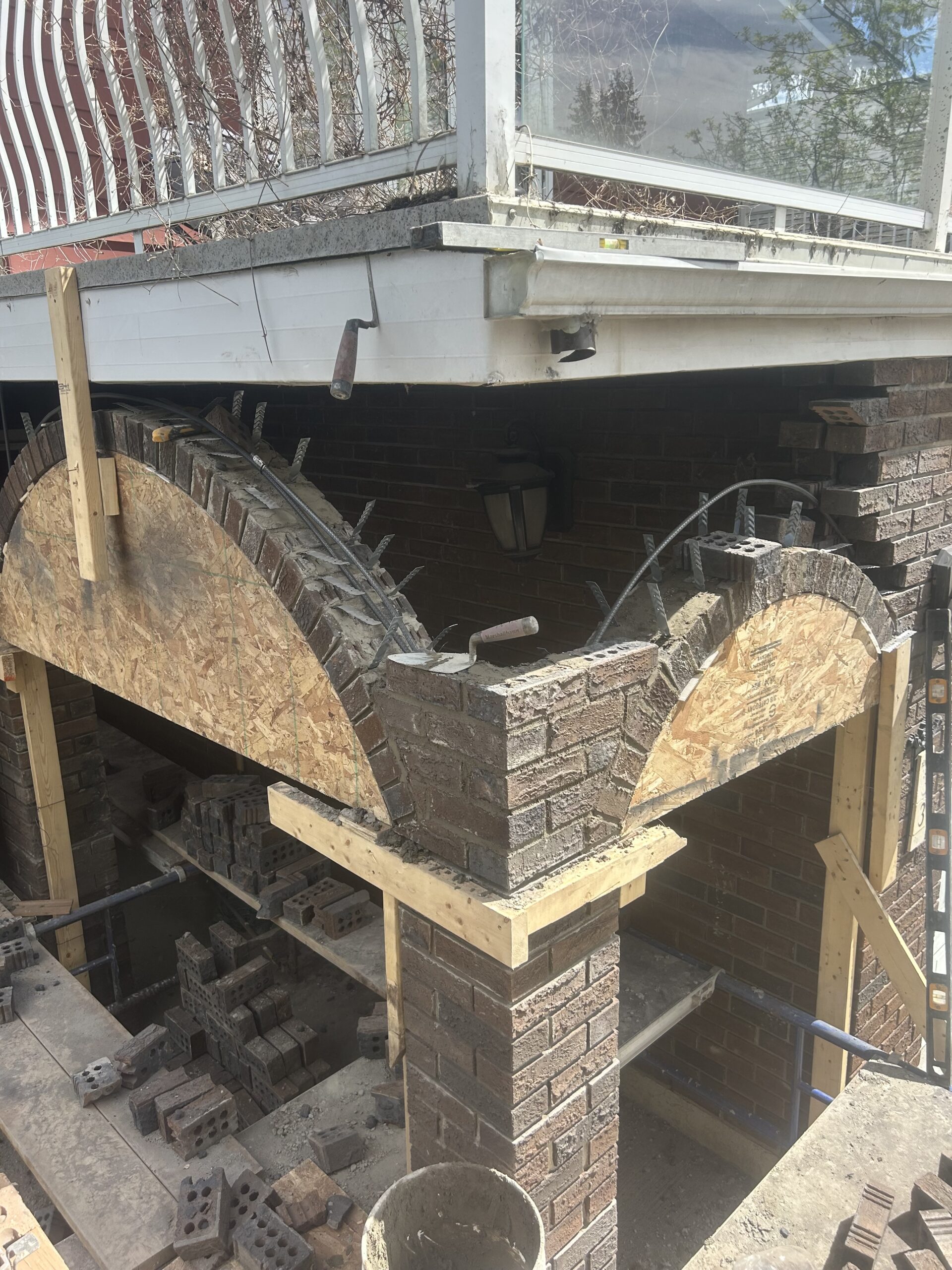 Brick masonry arch reconstruction with timber formwork and temporary support