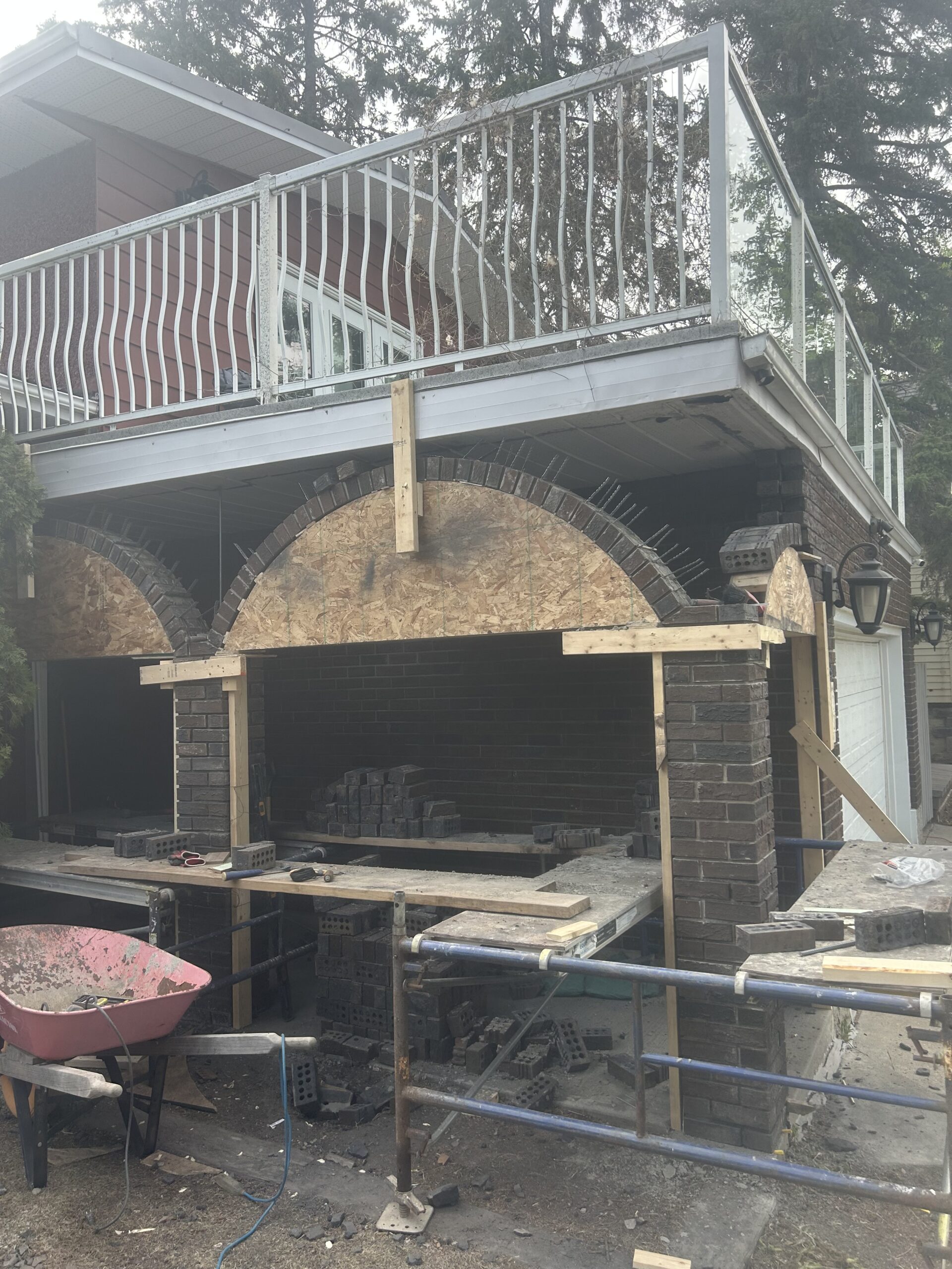 Multiple residential brick arches being rebuilt using timber centring and scaffold