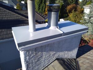 Custom metal chimney chase cover with two vent penetrations in Edmonton